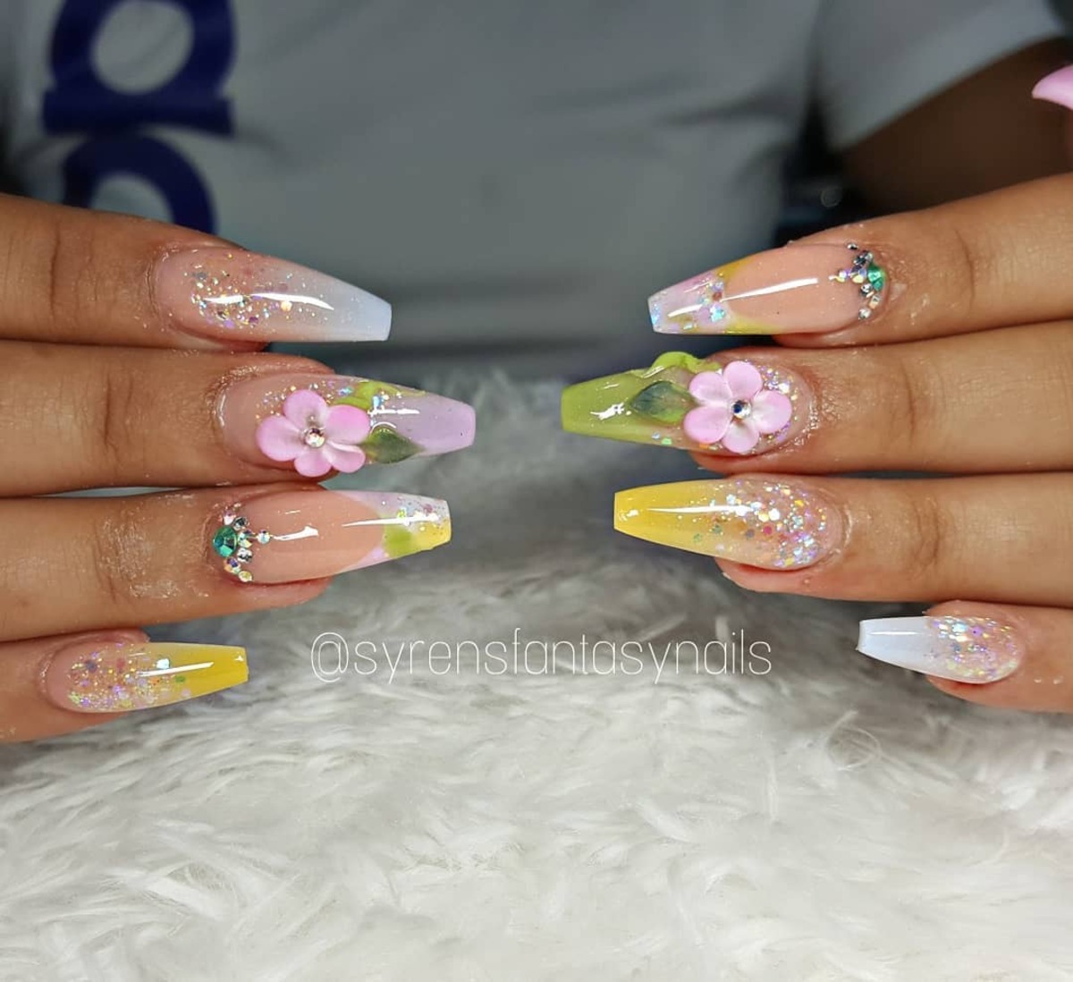 14. Dreamy Pastel Ombre Nails with Floral Accents