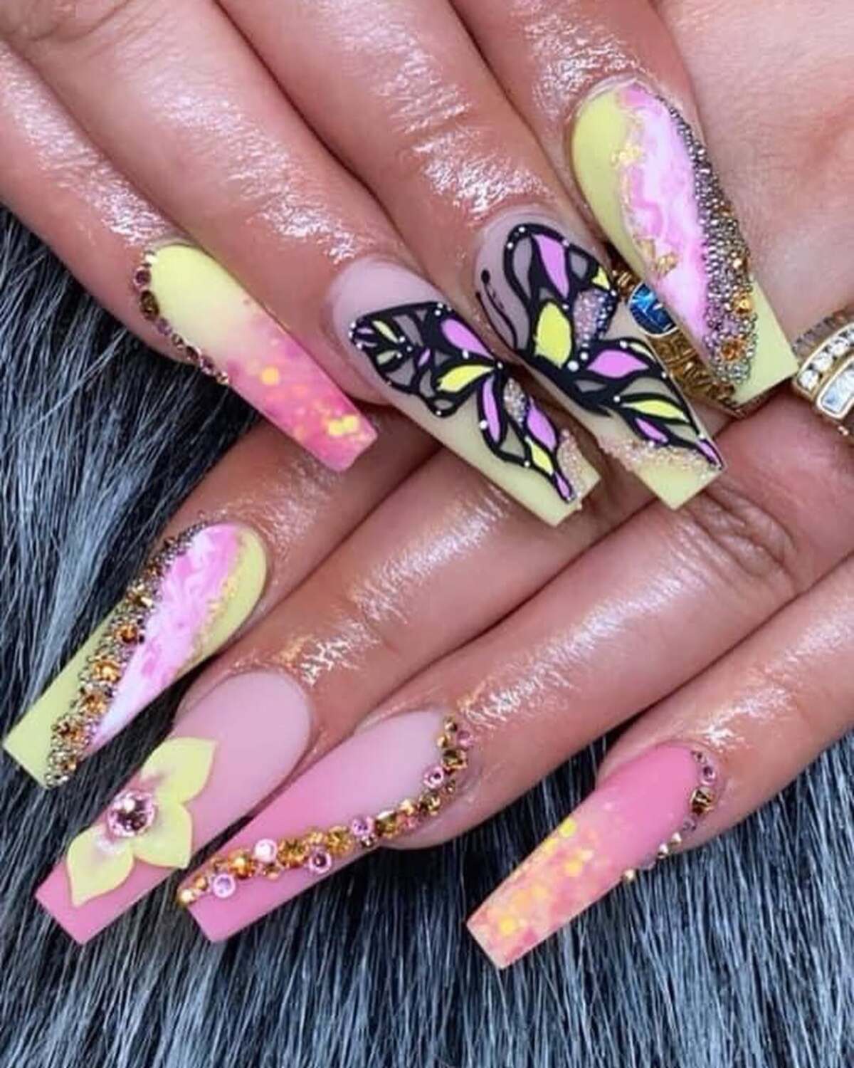 17. Butterfly and Floral Yellow-Pink Nail Art