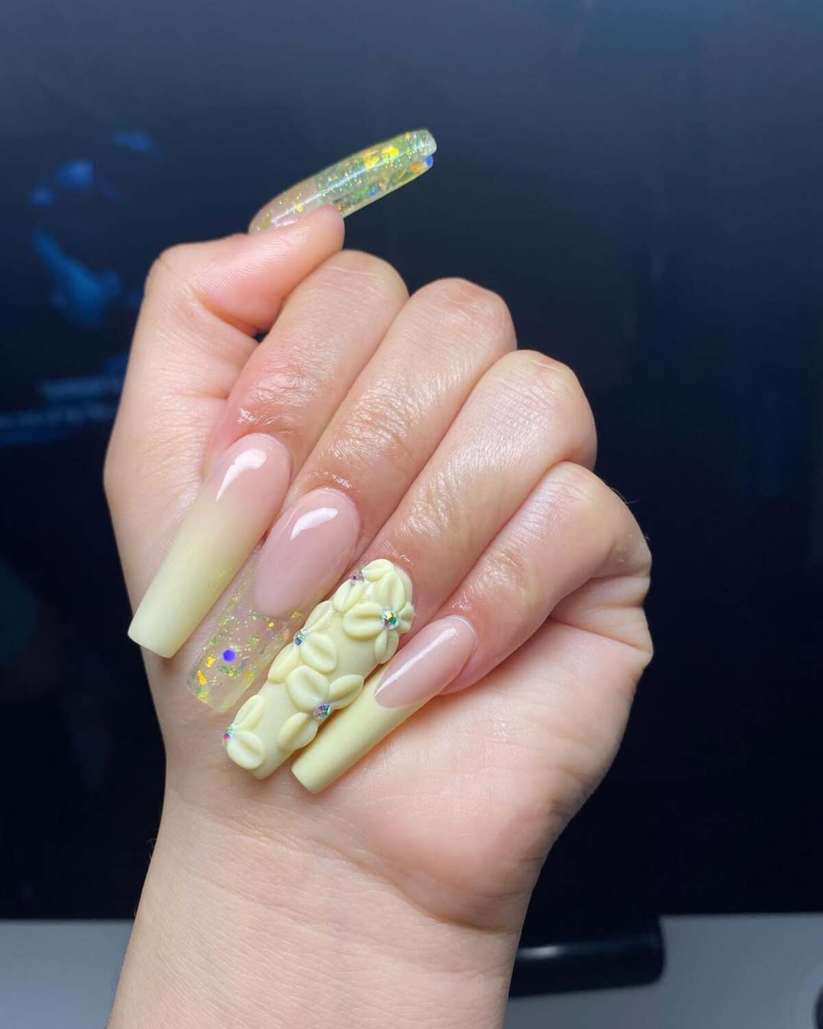 20. Pastel Yellow 3D Floral Nails with Glitter Accents