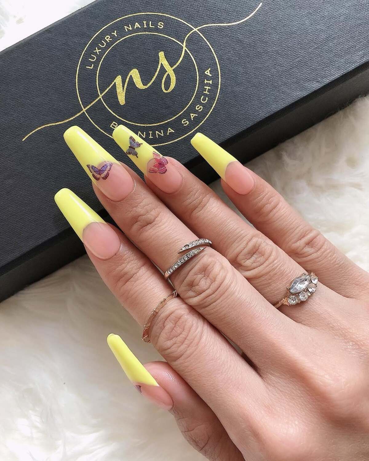 23. Soft Yellow French Tips with Butterfly Details