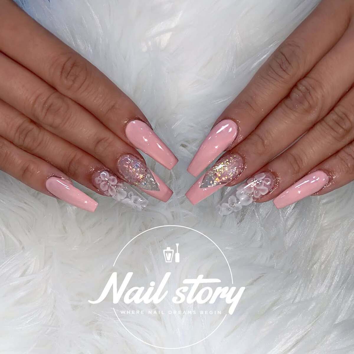 6. Blush Pink French Tips with Floral & Glitter Accents