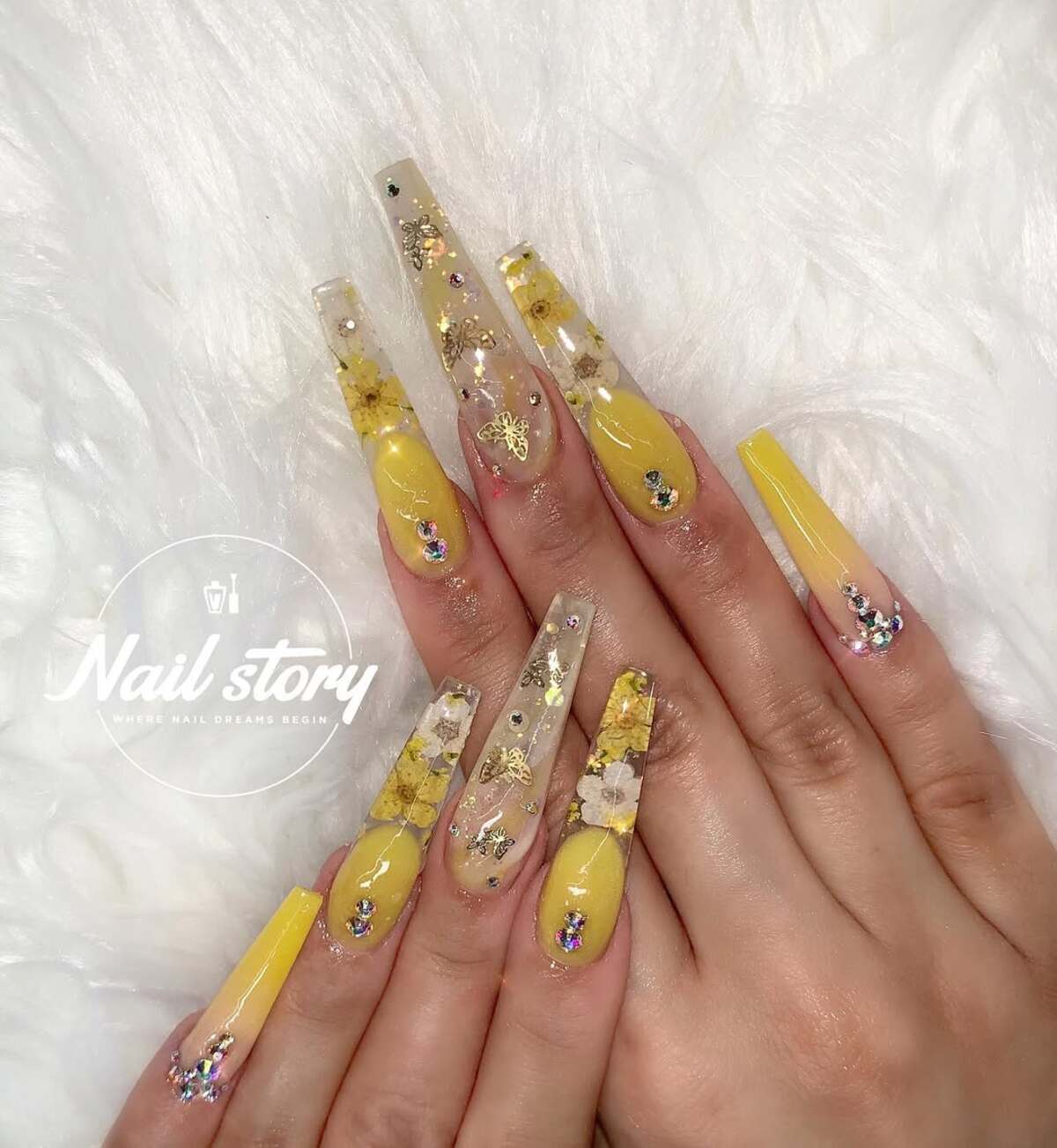 8. Elegant Yellow & Gold Floral Coffin Nails