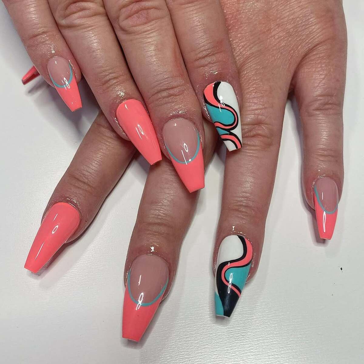 24. Retro Swirls and Coral French Tips