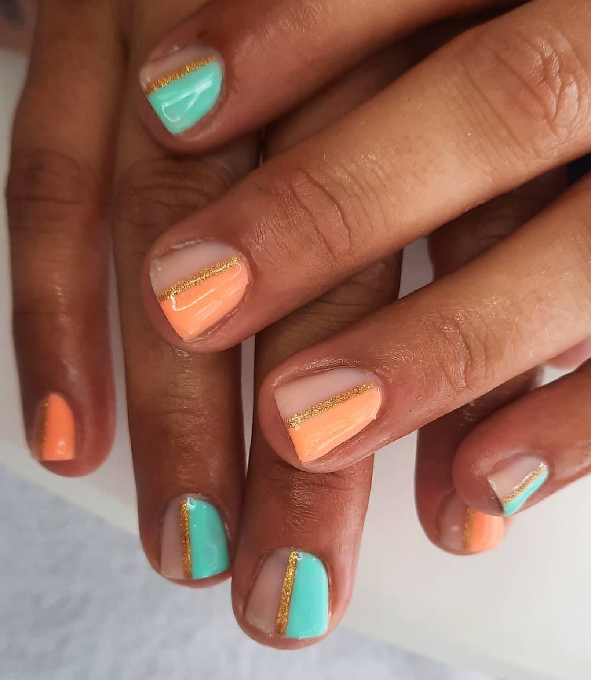 7. Minimalist French Tips with Gold Accents