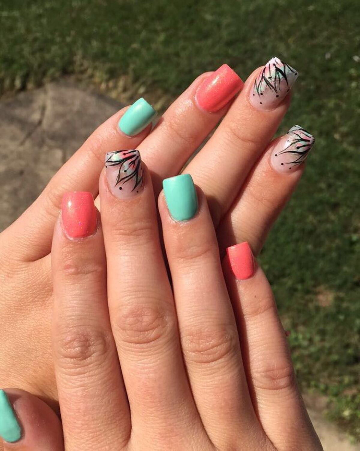 9. Nature-Inspired Coral and Mint Nails