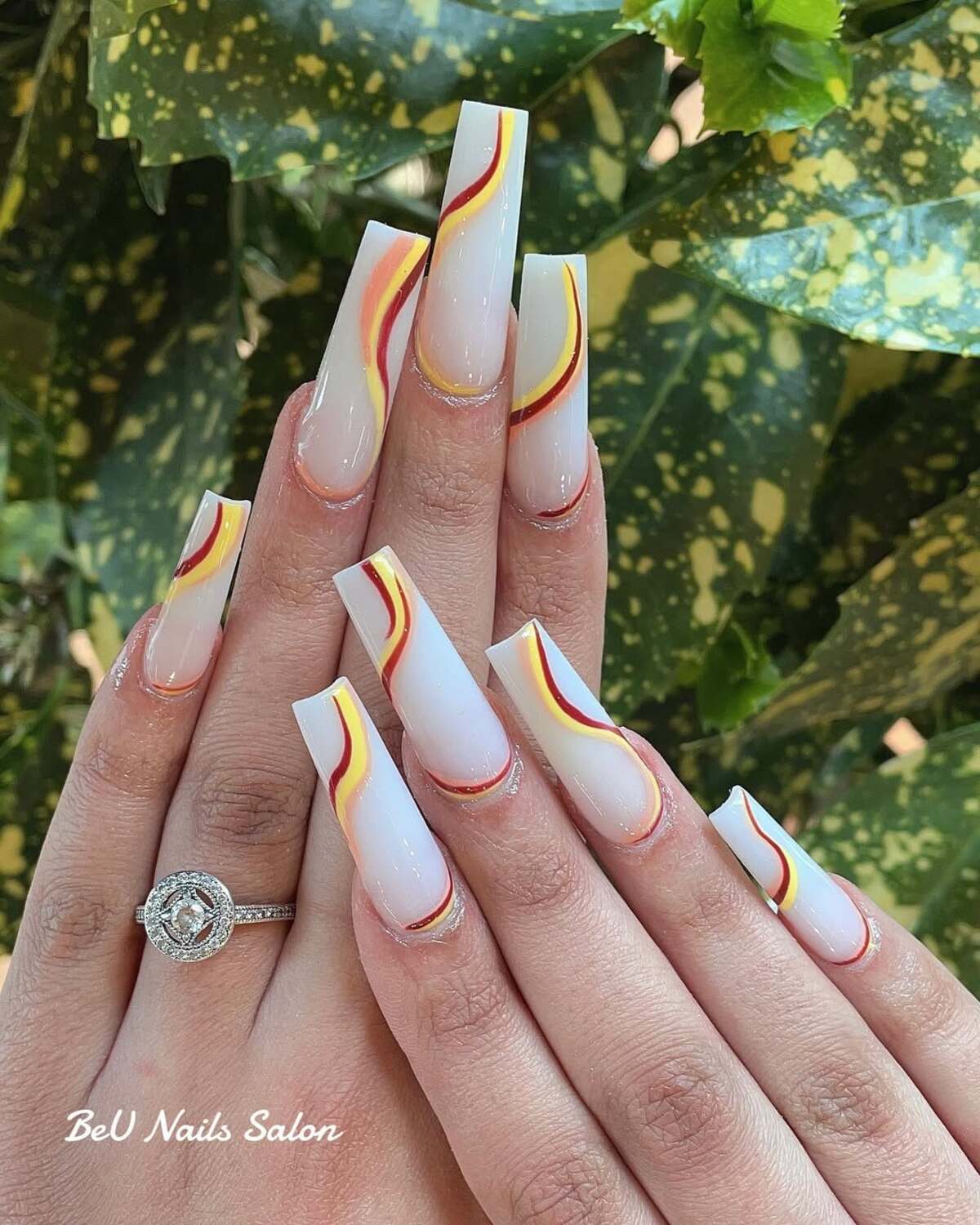 11. Sunset Swirls on a Glossy White Base