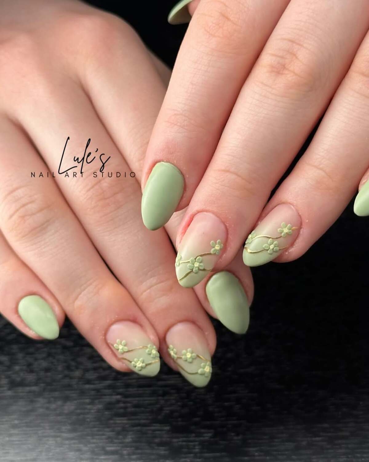 15. Pastel Green Floral Accent Nails with Gold Details