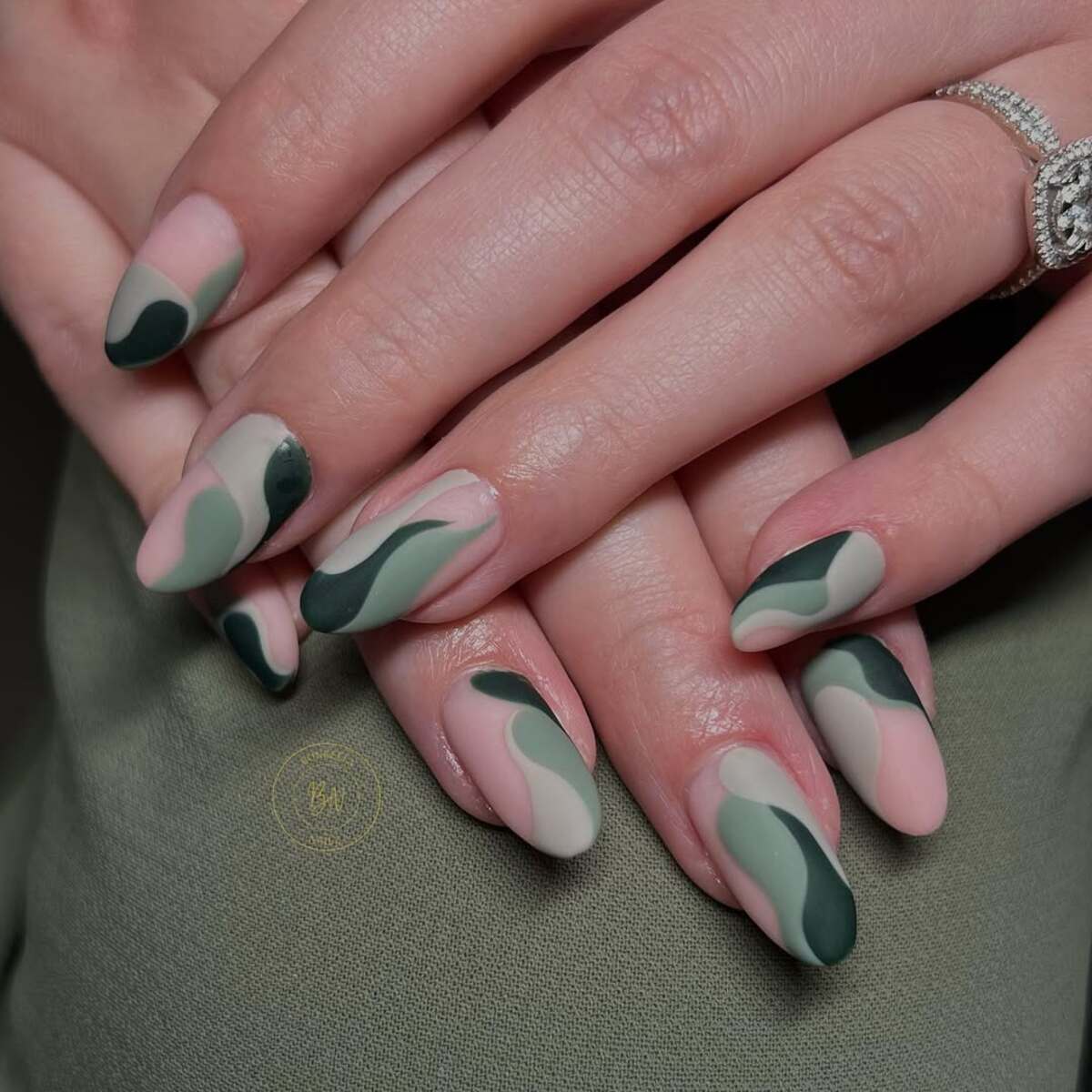 16. Abstract Matte Green and Nude Nail Art