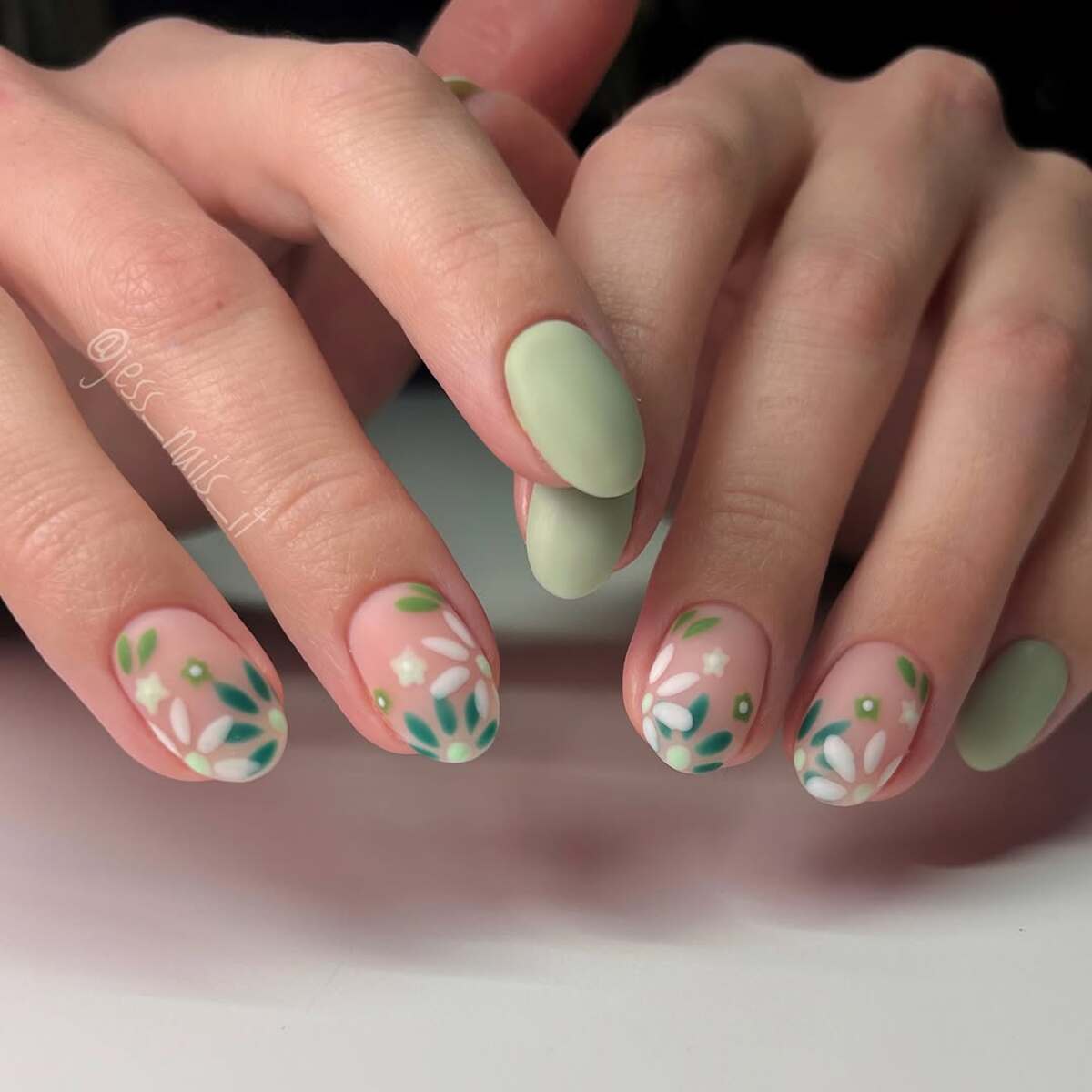 19. Delicate Floral Matte Sage Green Nails