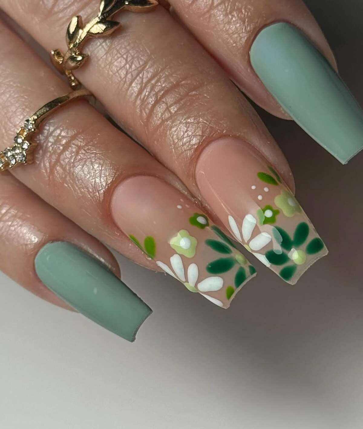 2. Earthy Green and Nude Floral Garden Nails
