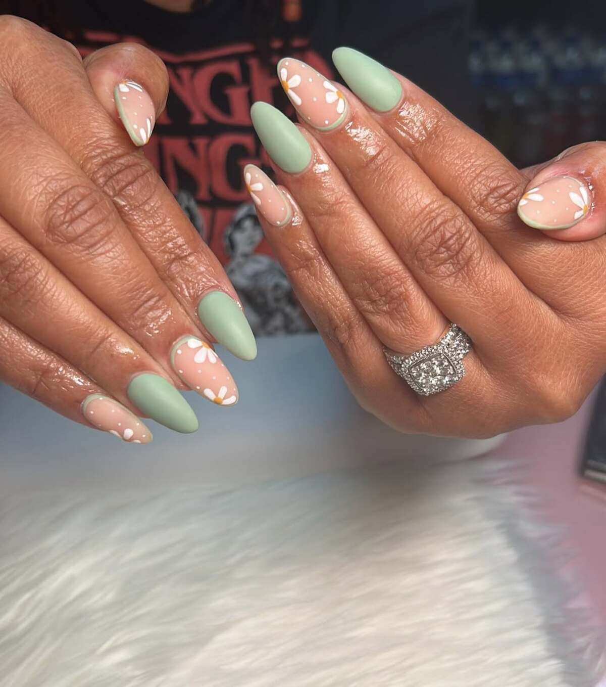 23. Soft Almond Sage Green and Daisy Nails
