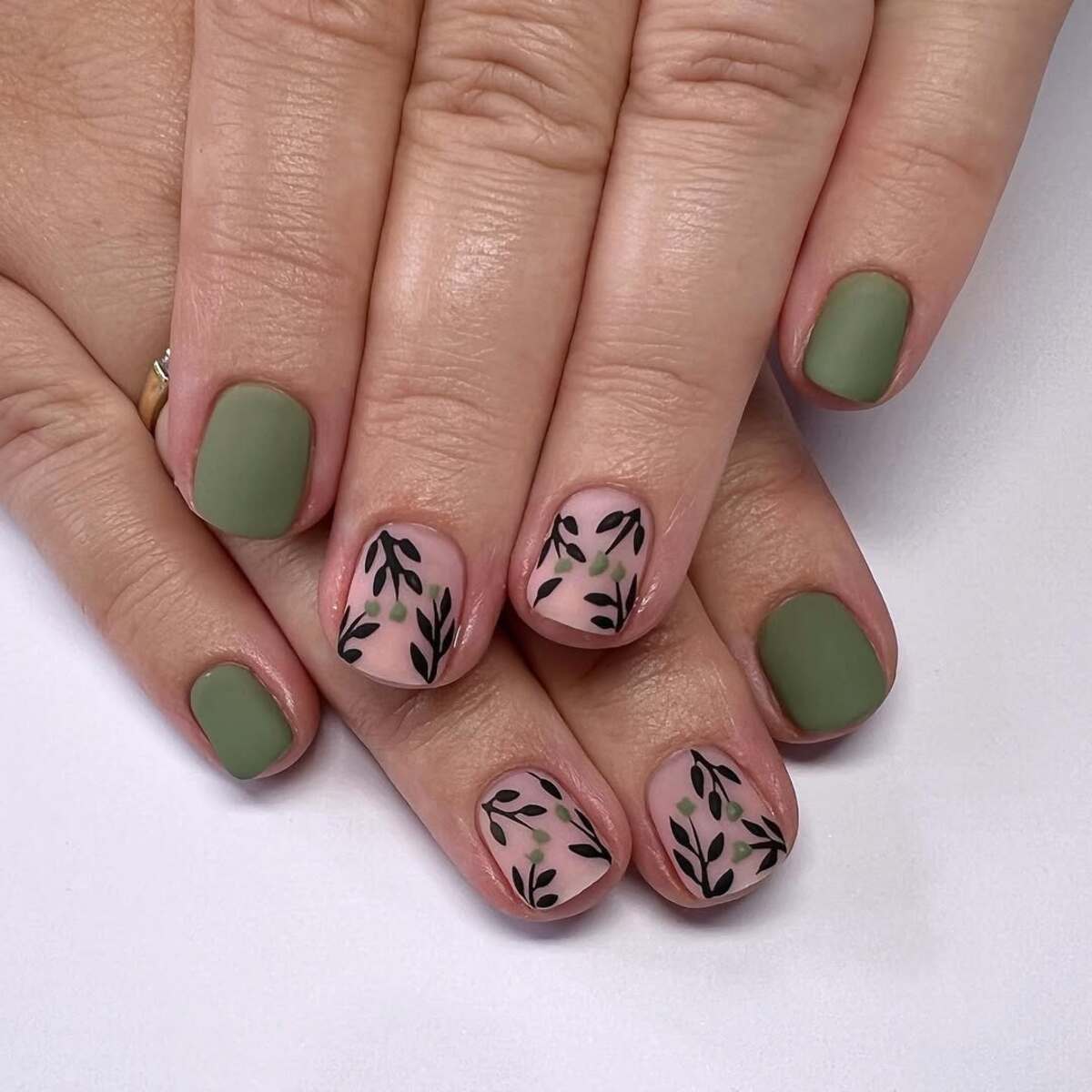 5. Minimalist Green with Delicate Leaf Accents