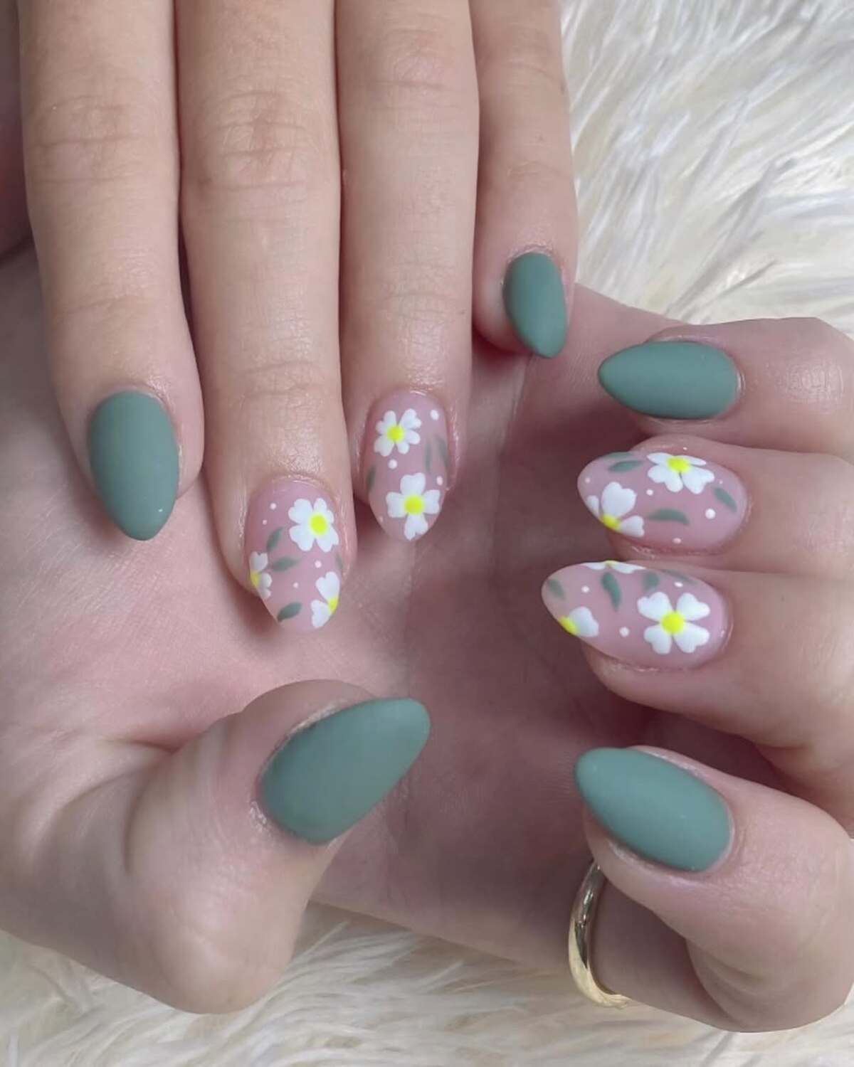 8. Almond-Shaped Sage Green and Daisy Nails