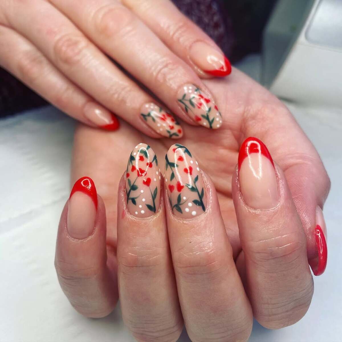 10. Romantic Red French Tips with Floral Vine Details