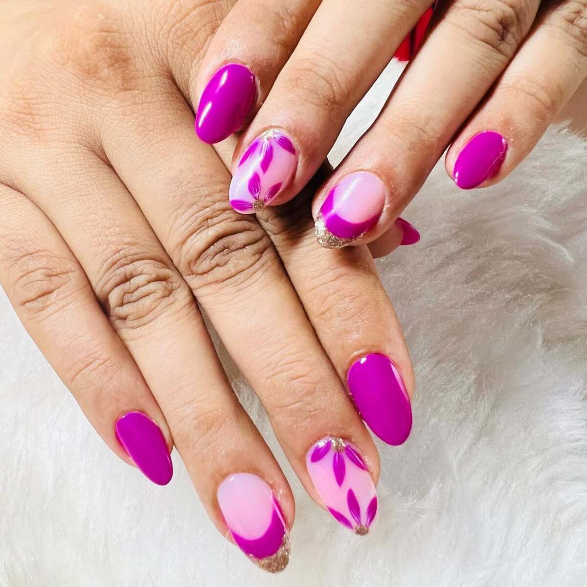 14. Bold Magenta French Tips with Floral Accents