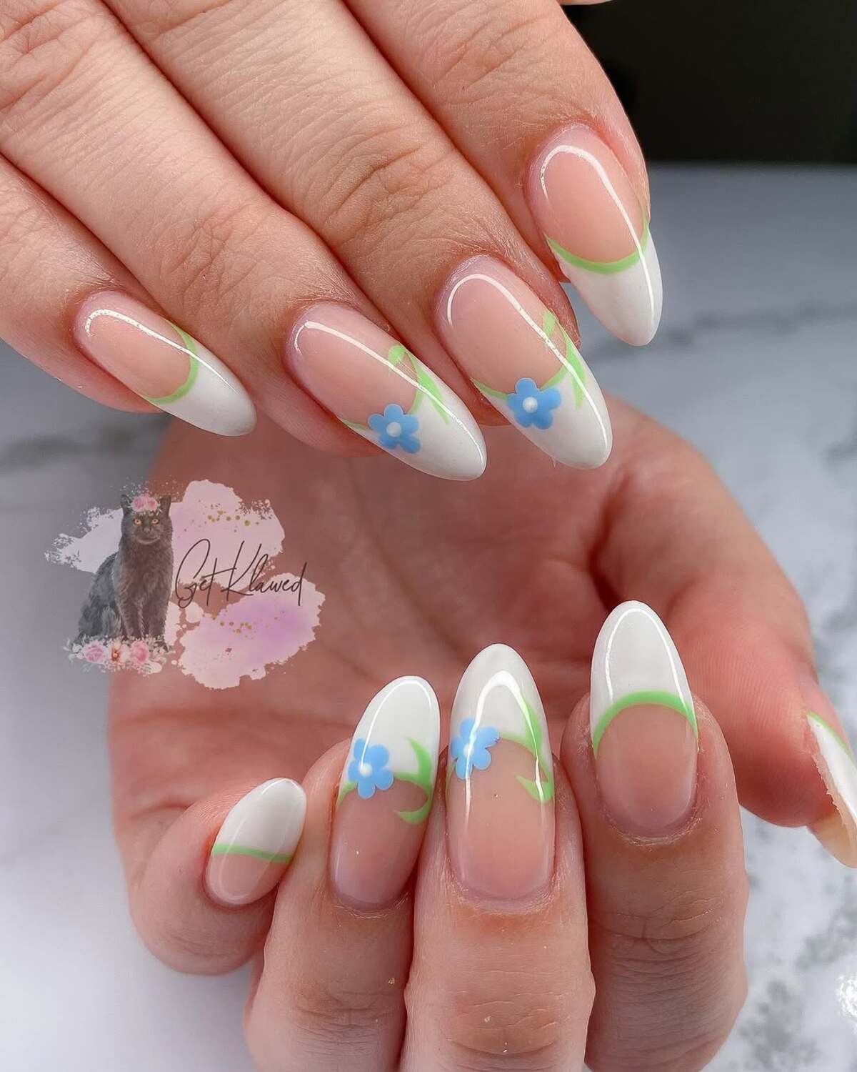 15. White and Green French Tips with Blue Floral Touches