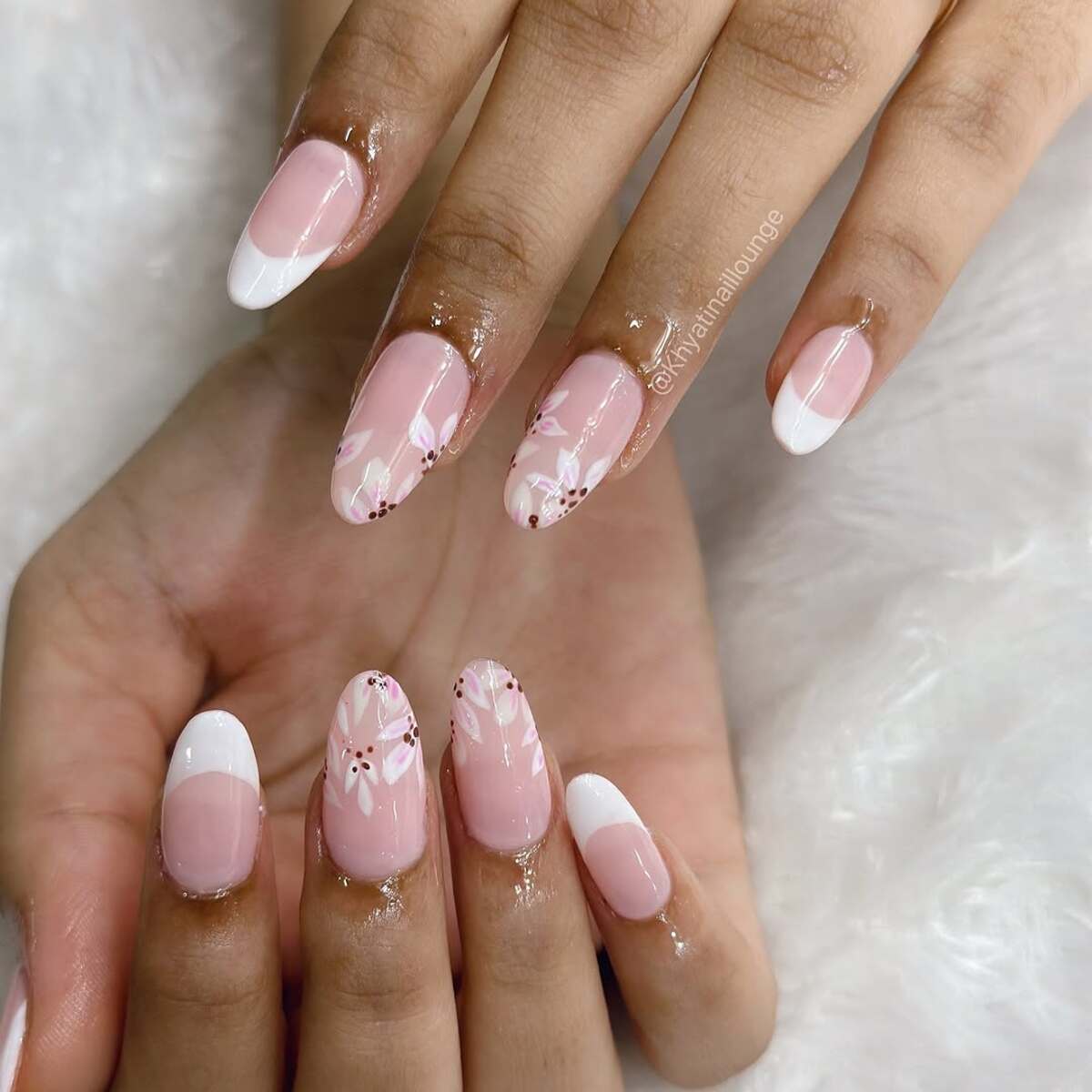 18. Elegant White French Tips with Floral Accents