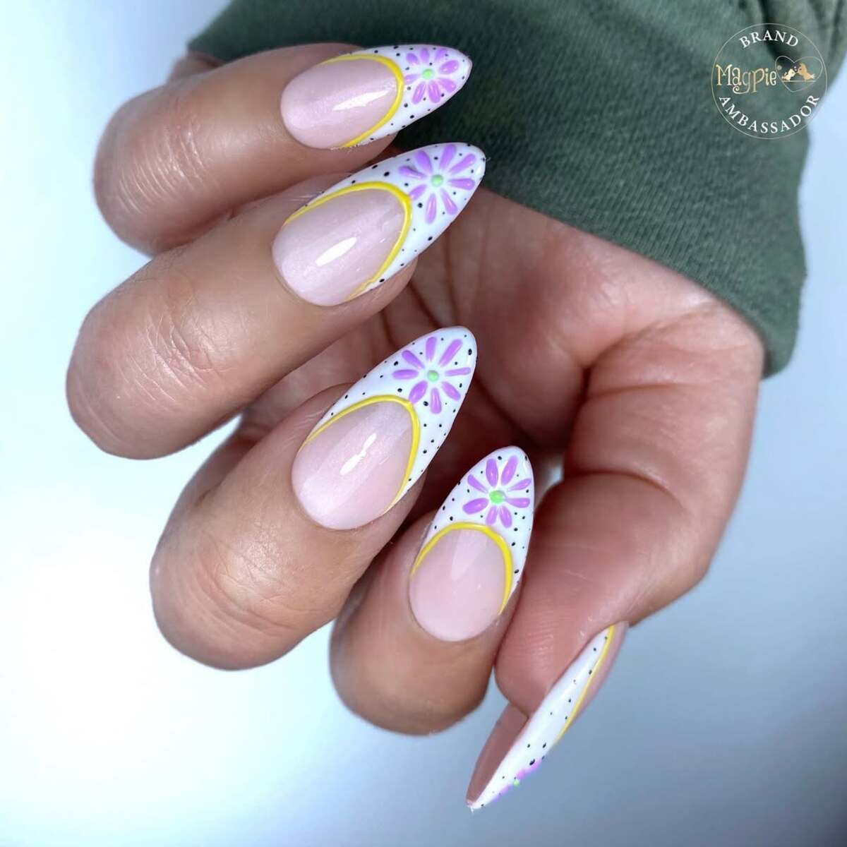 21. Floral White and Yellow French Tips with a Modern Twist