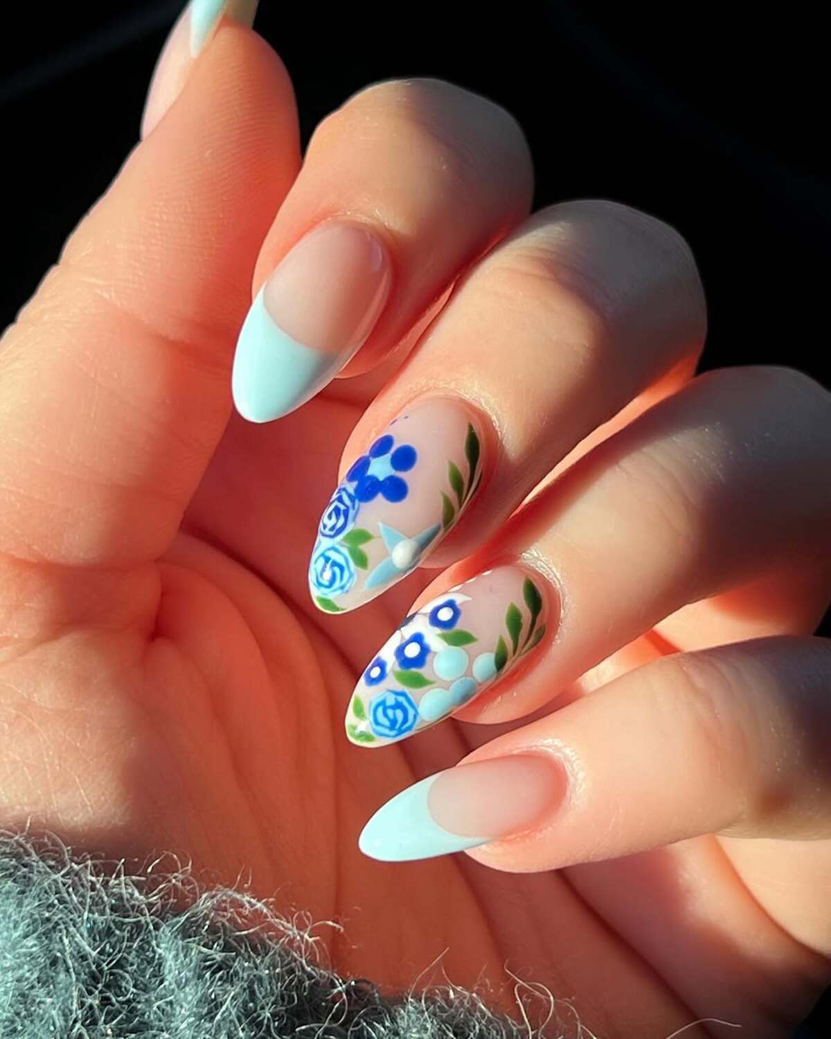 6. Blue and White French Tips with Floral Accents