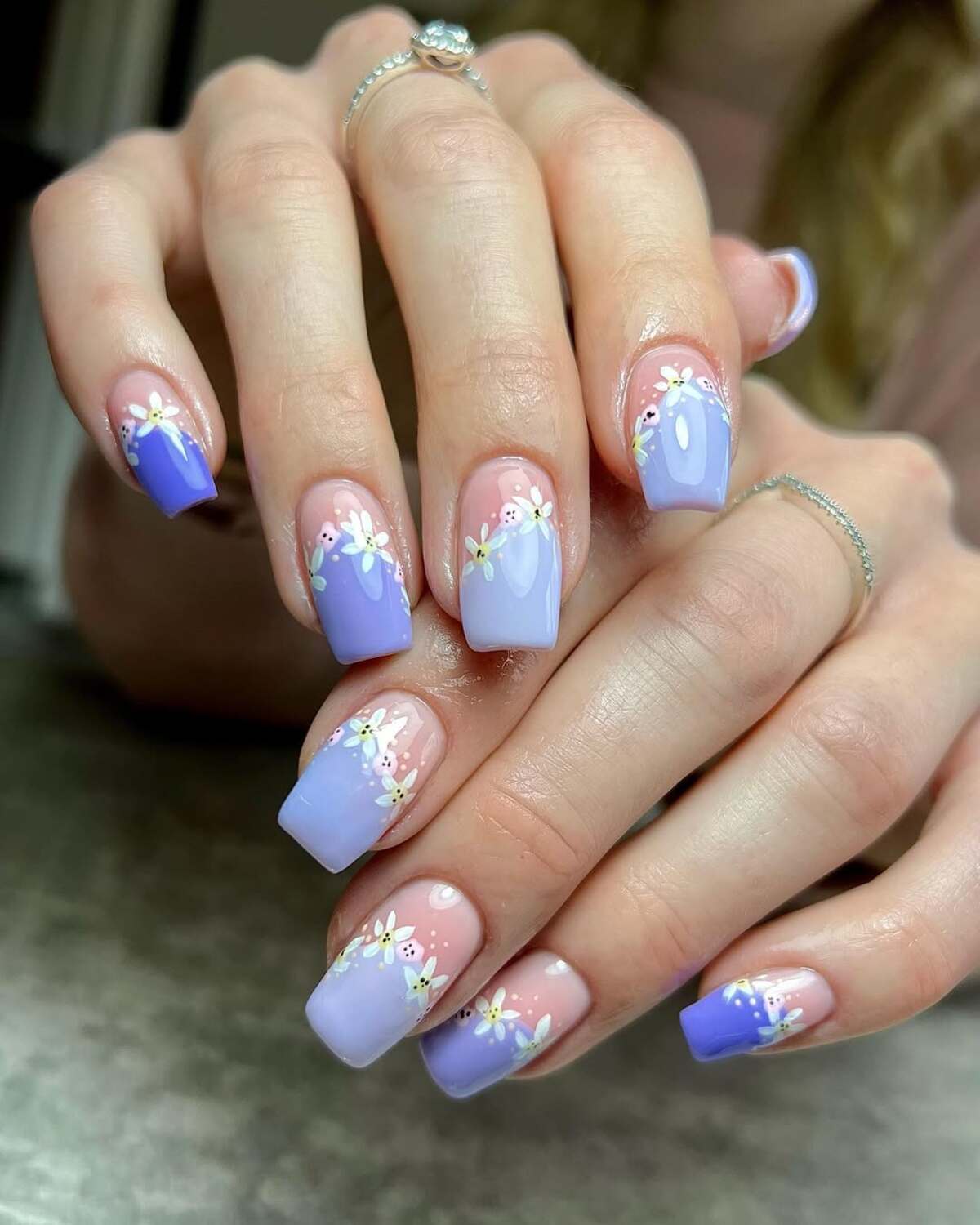 18. Soft Lavender French Tips with Daisy Accents