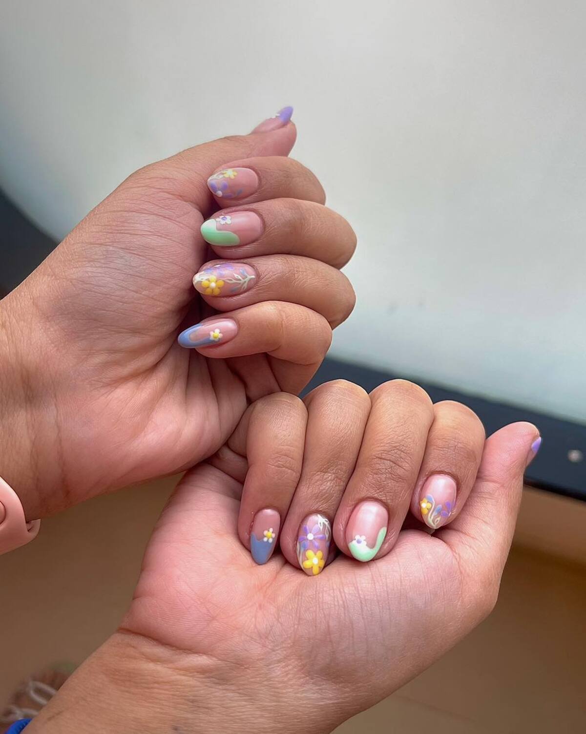 20. Pastel Garden Nail Art with Tiny Blooms