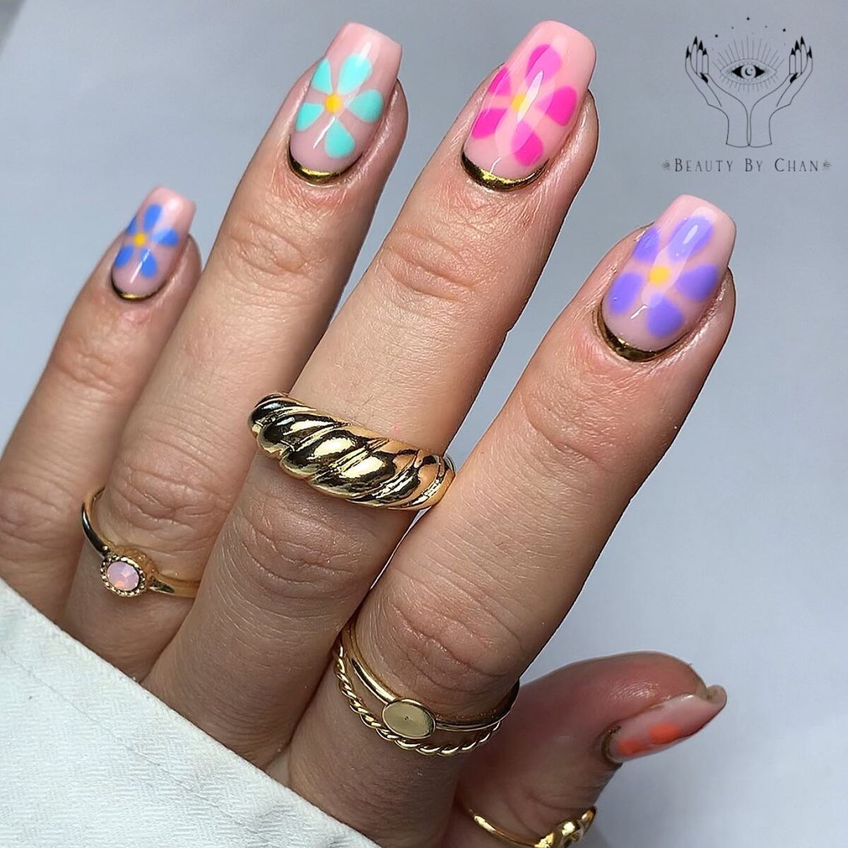 21. Bold Pastel Blooms with Gold Outlines