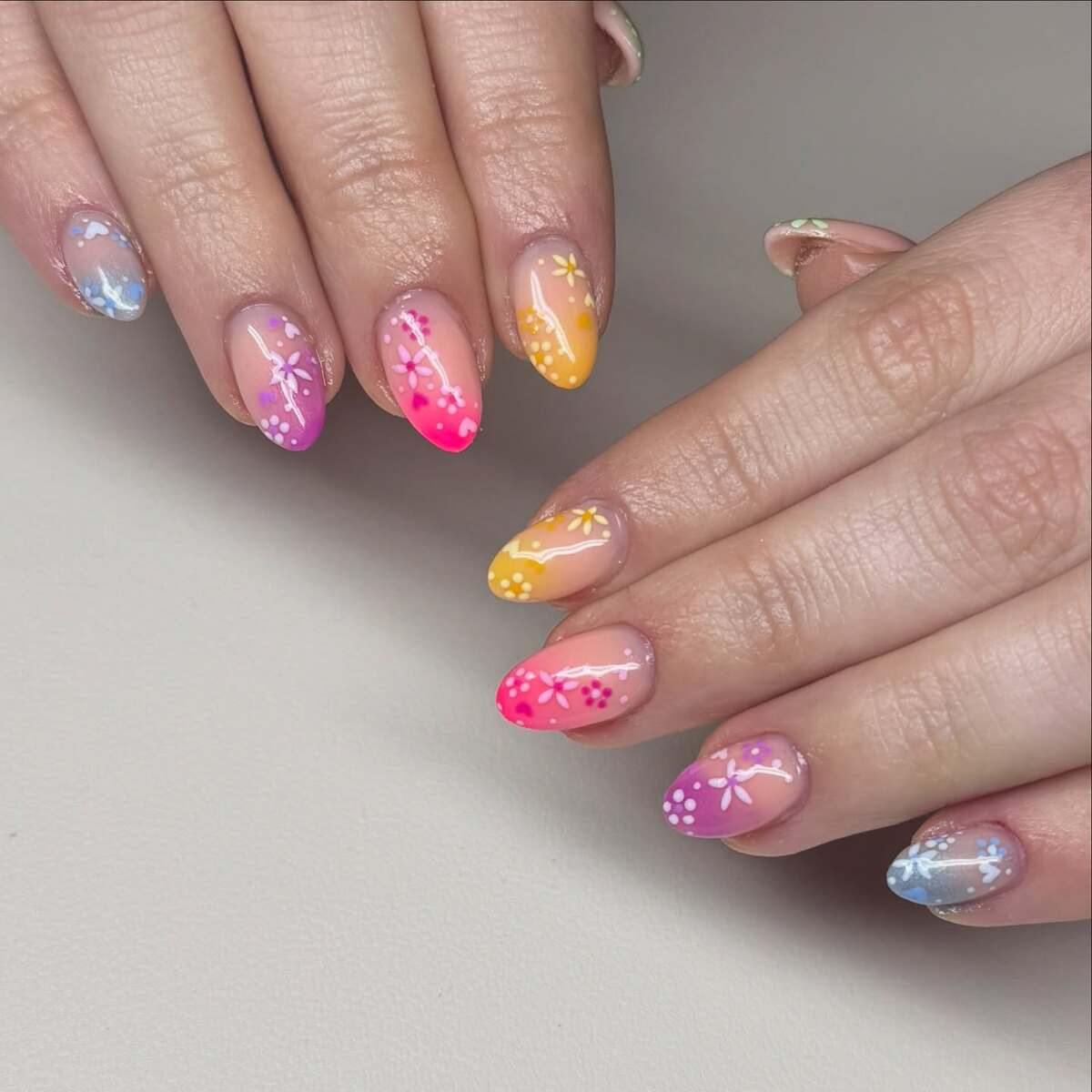 22. Pastel Ombre Nails with Whimsical Floral Details