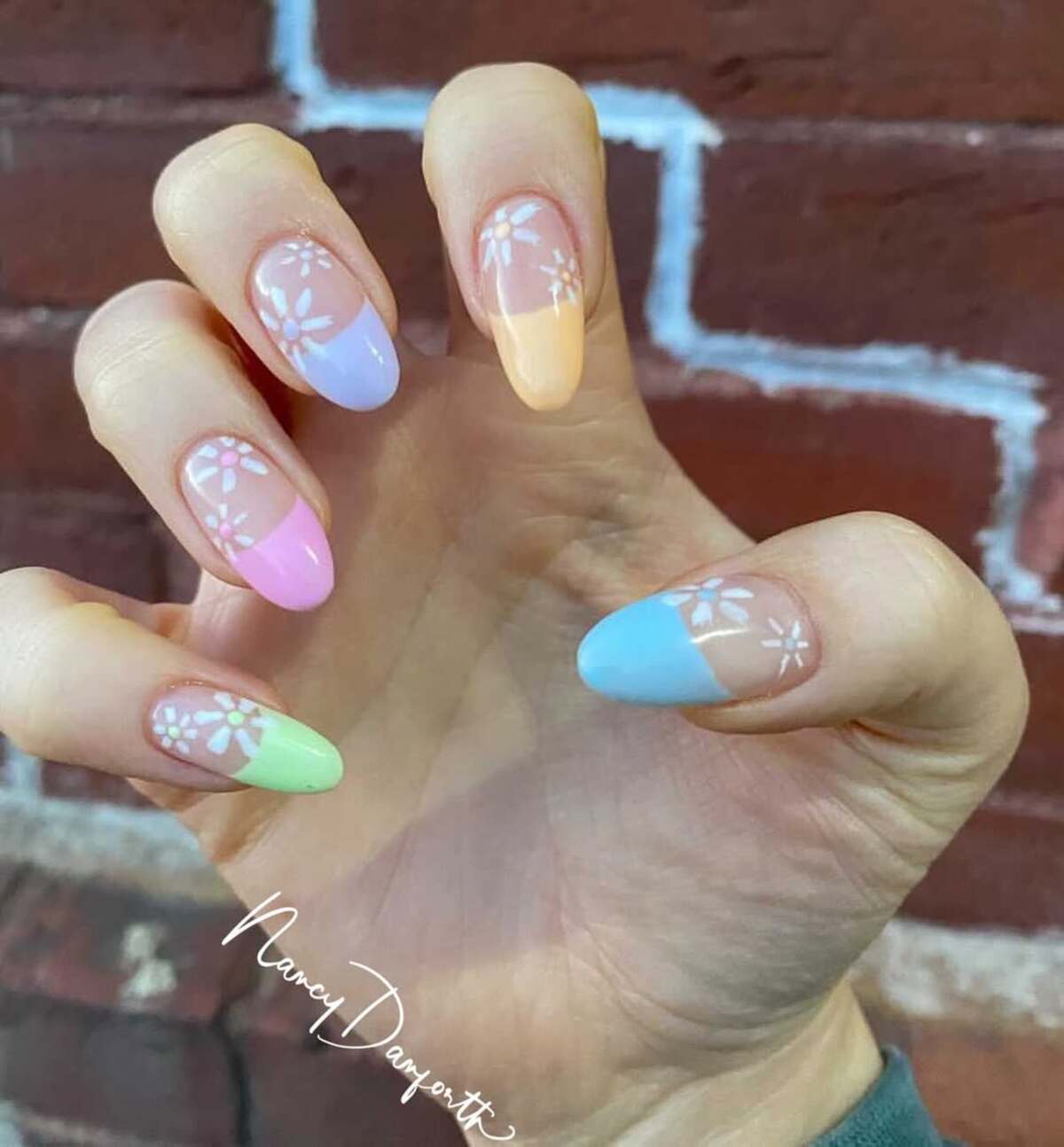 6. Subtle Pastel French Tips with Floral Touches