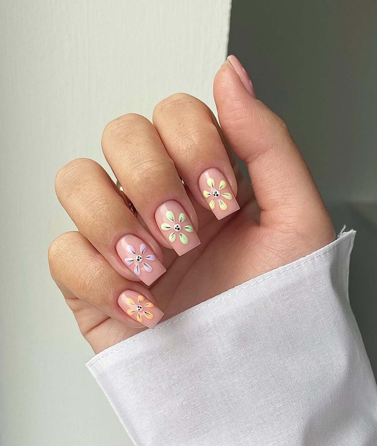 7. Glossy Pastel Petals on a Nude Base