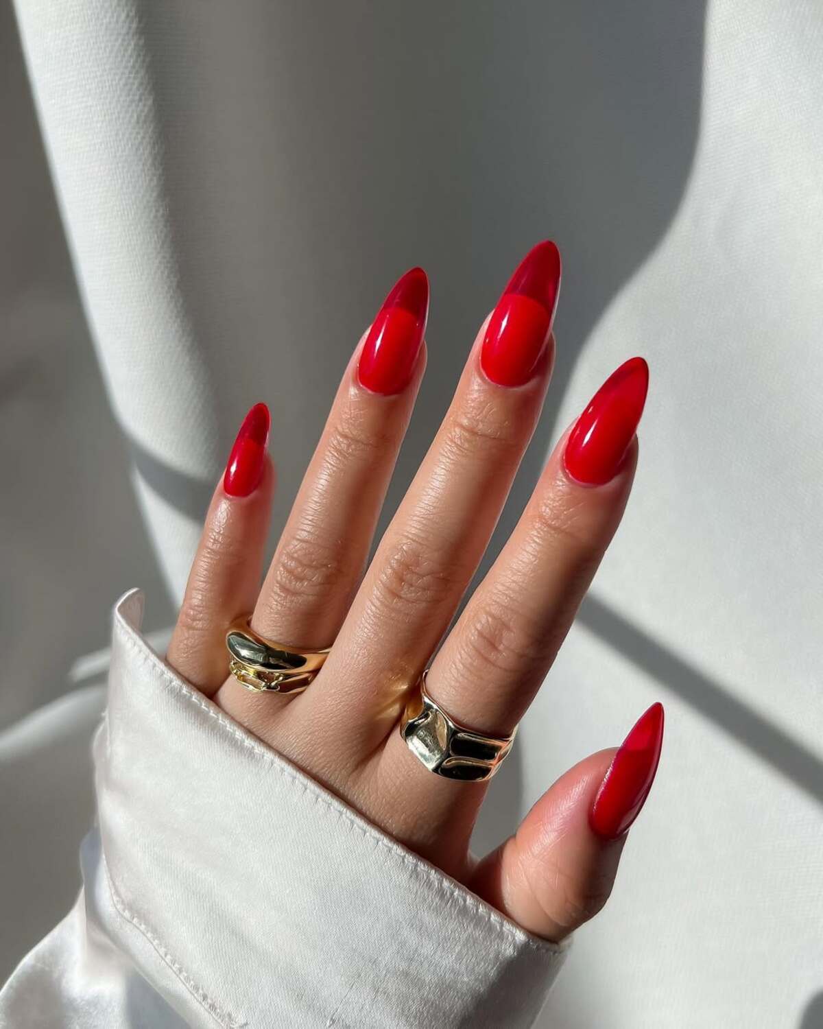 24. Glossy Deep Red Almond Nails