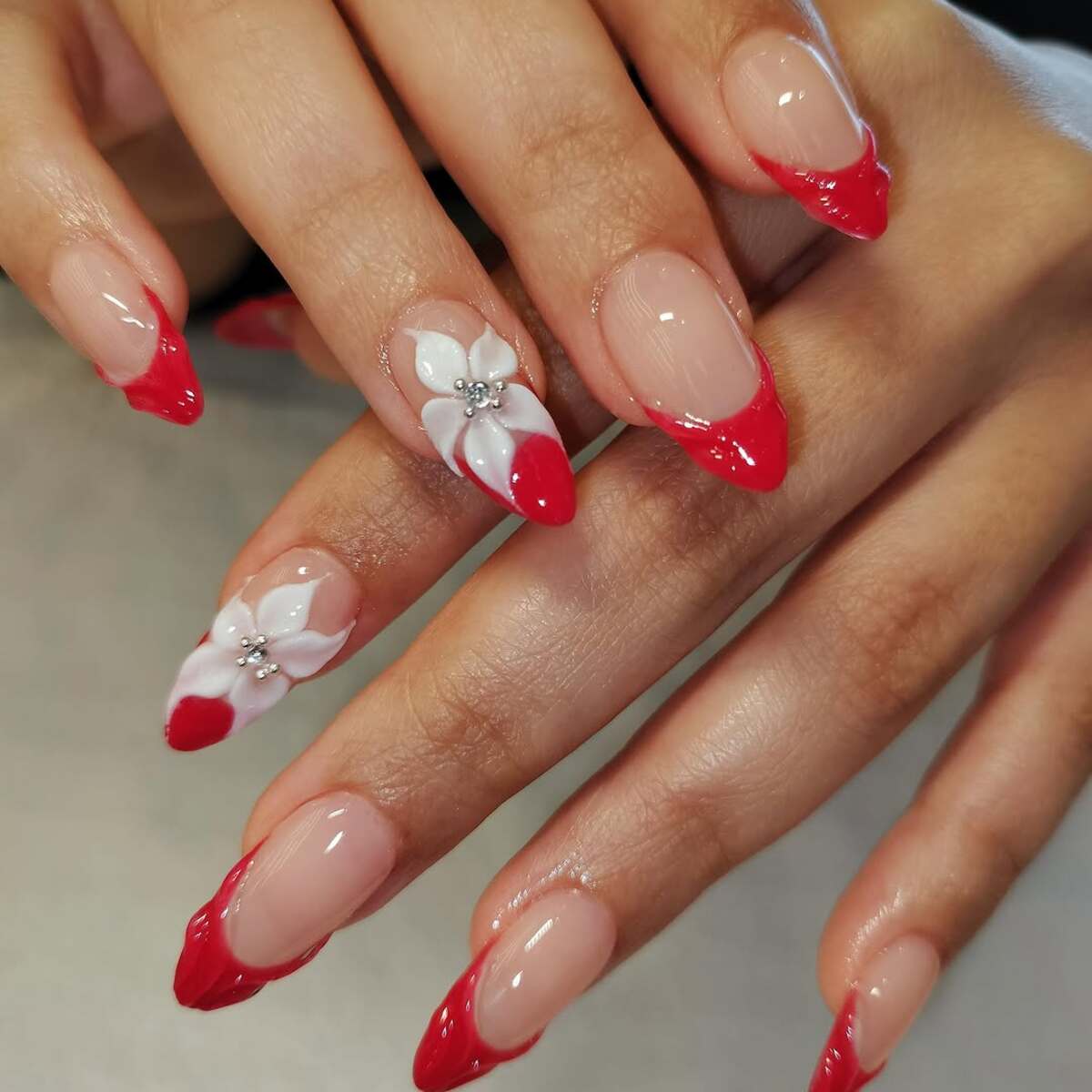 3. Red French Tips with Floral 3D Details