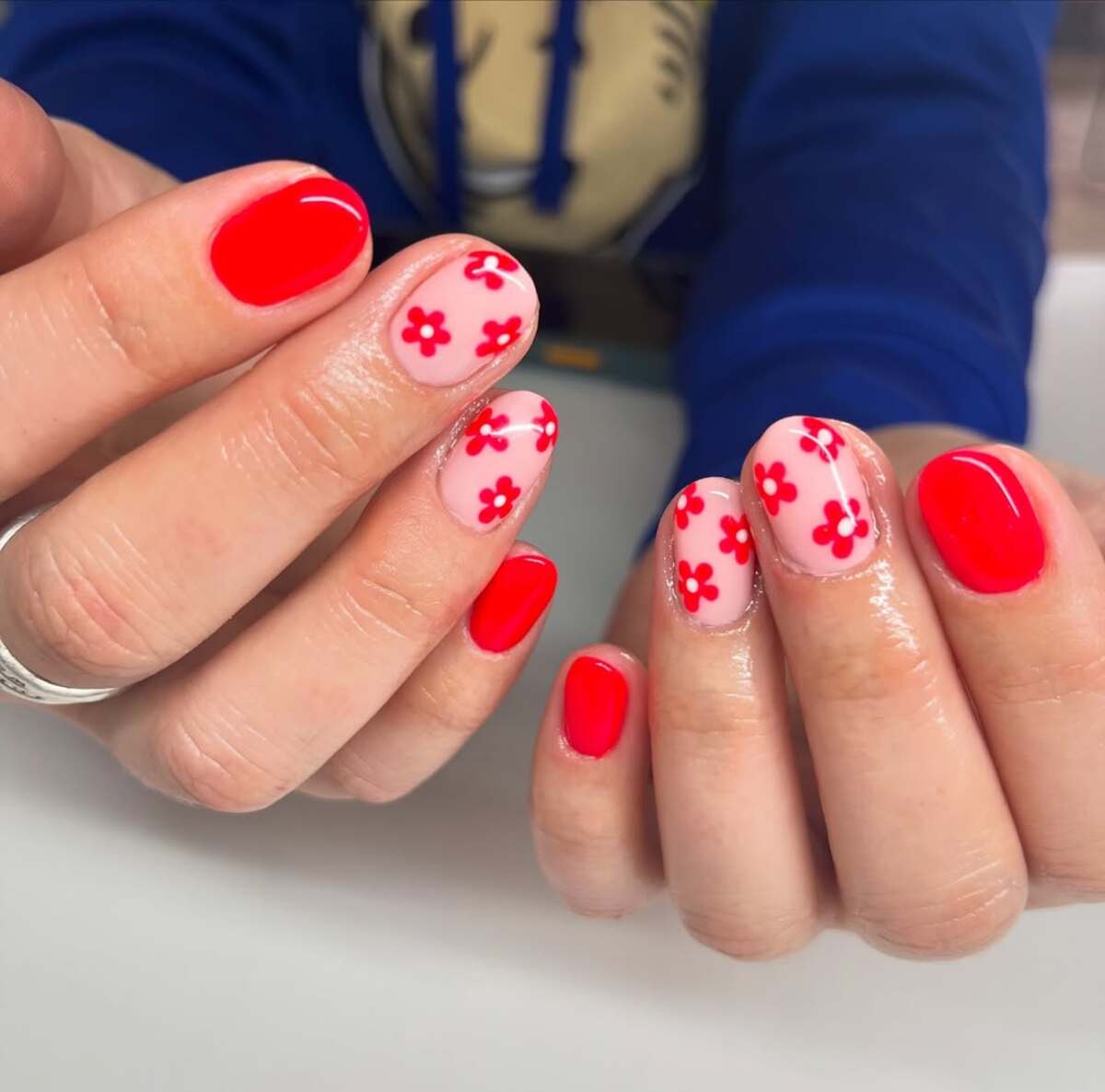 5. Playful Red and Floral Nail Art