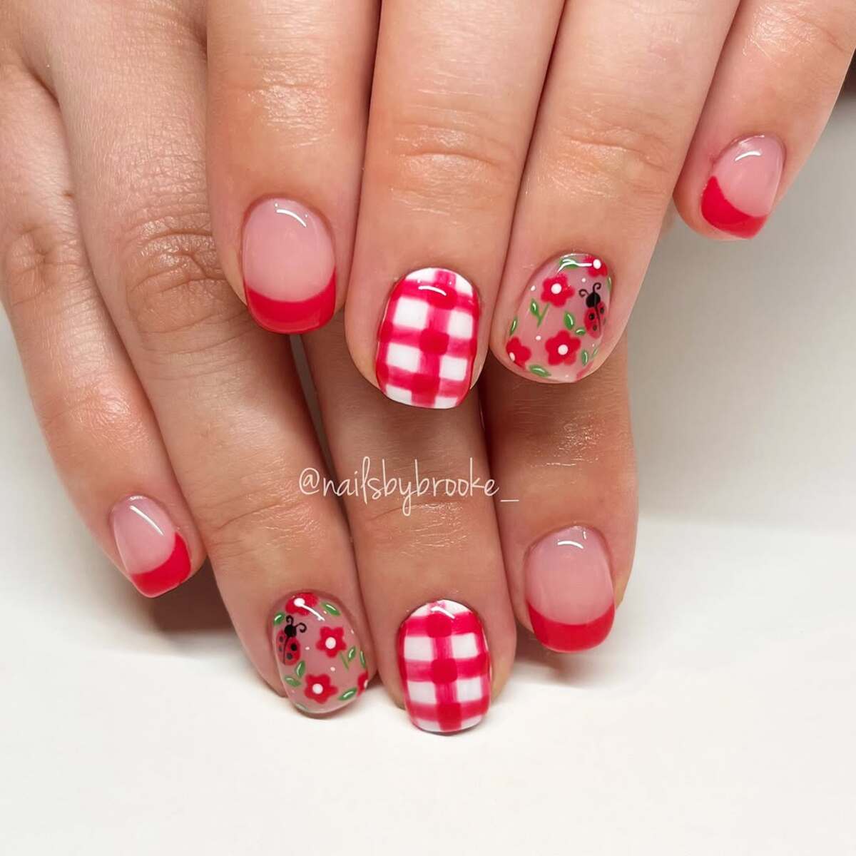 7. Gingham and Floral Red Nails