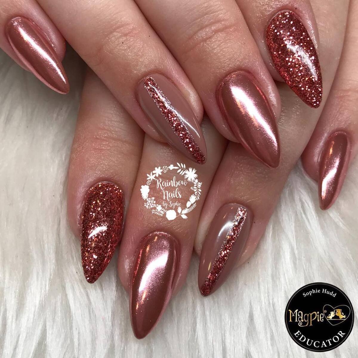 1. Chic Stiletto Rose Gold Nails with Glitter Accents