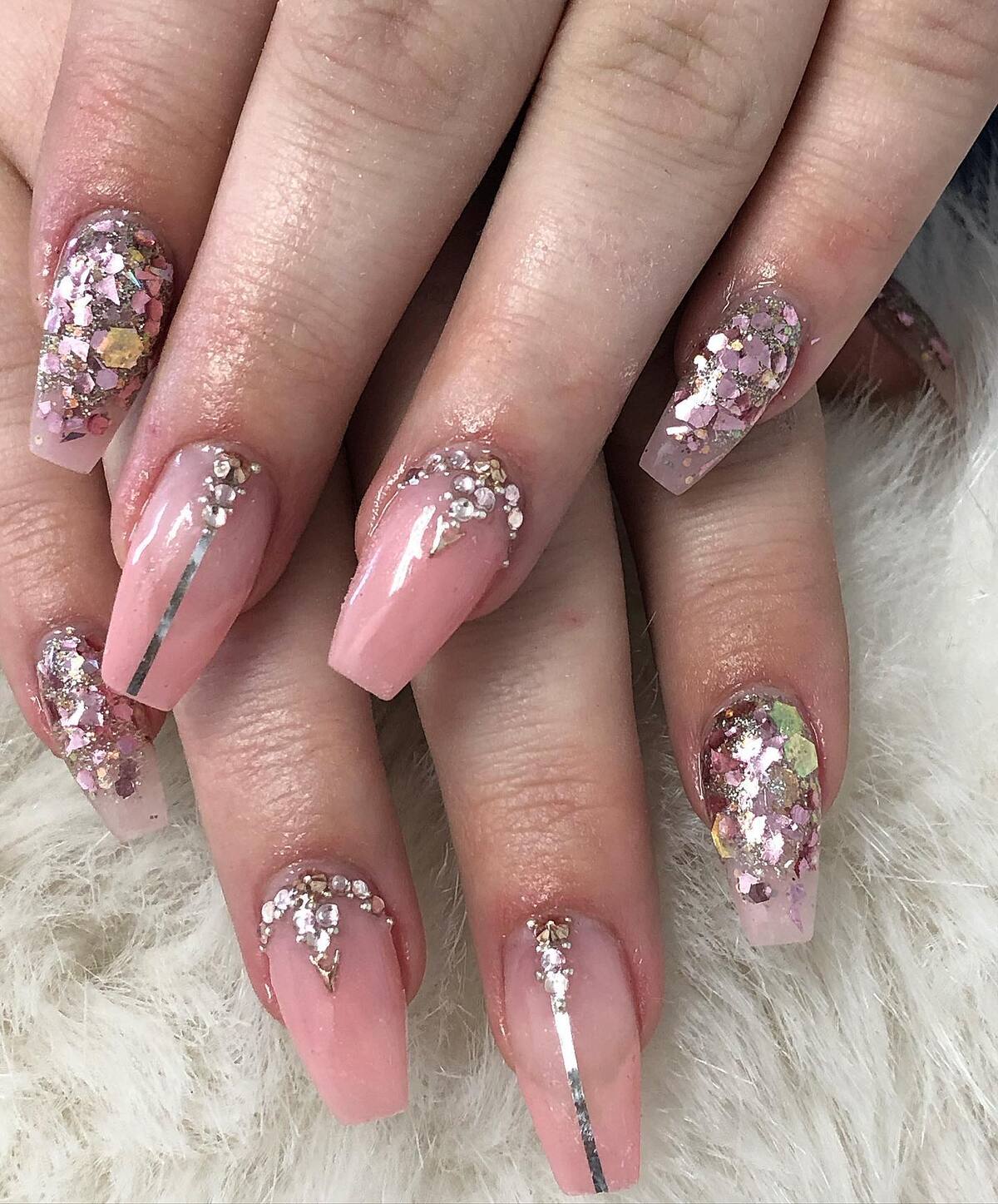 10. Delicate Pink Nails with Glitter and Rhinestone Accents