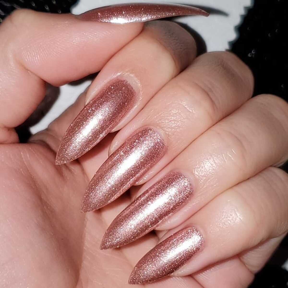 11. Sleek Metallic Rose Gold Stiletto Nails