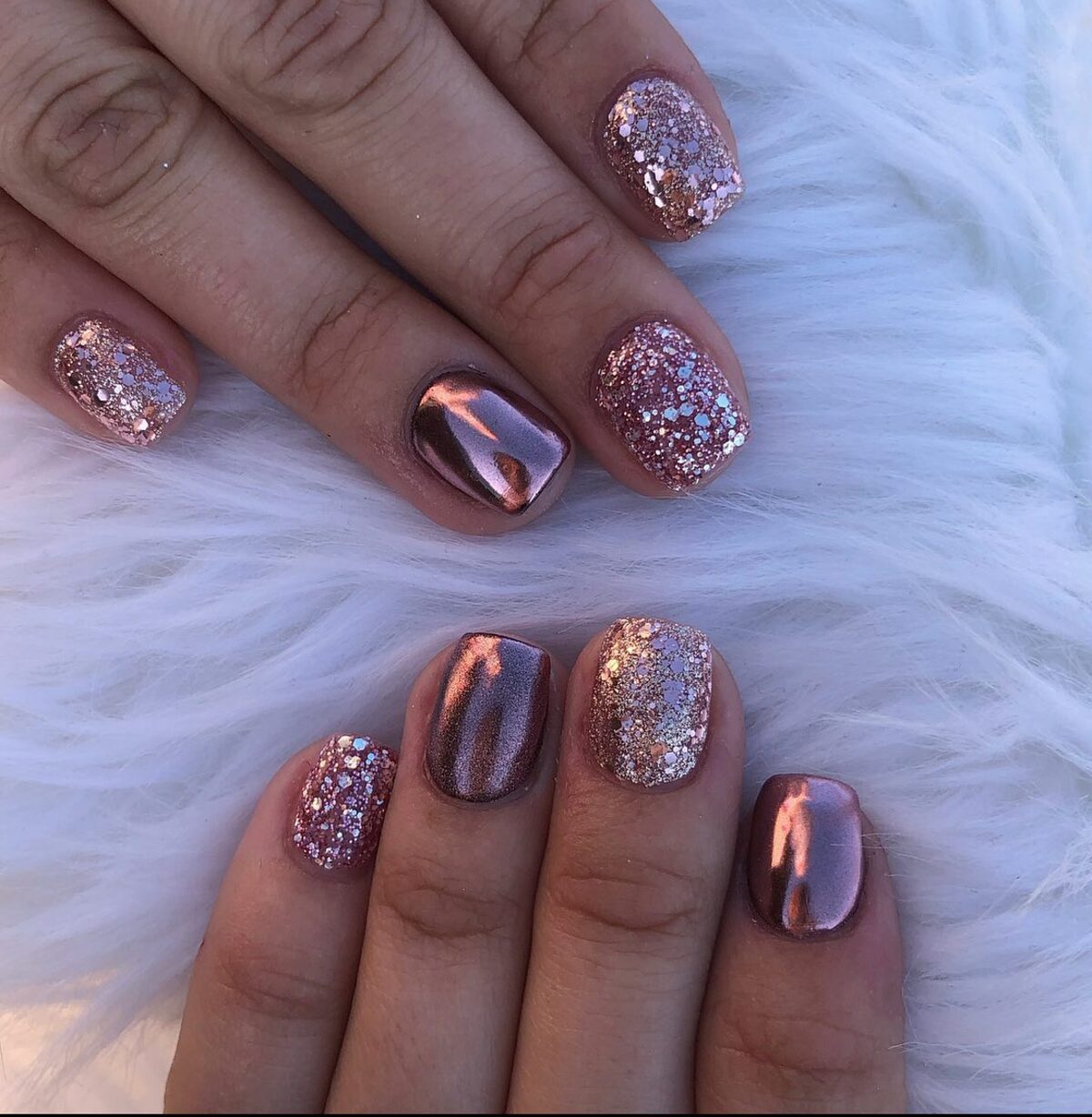 12. Glitter and Chrome Rose Gold Short Nails
