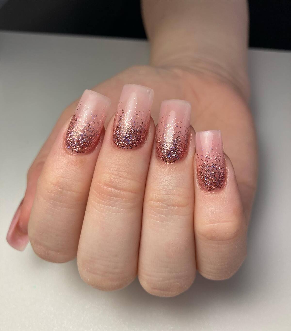 14. Soft Ombré Rose Gold Glitter Nails