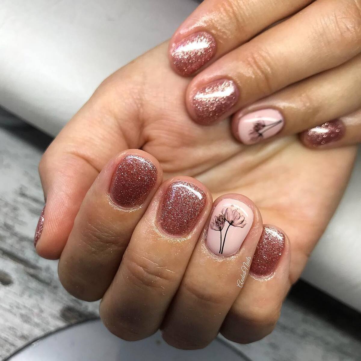 2. Short and Sweet Rose Gold Glitter Nails
