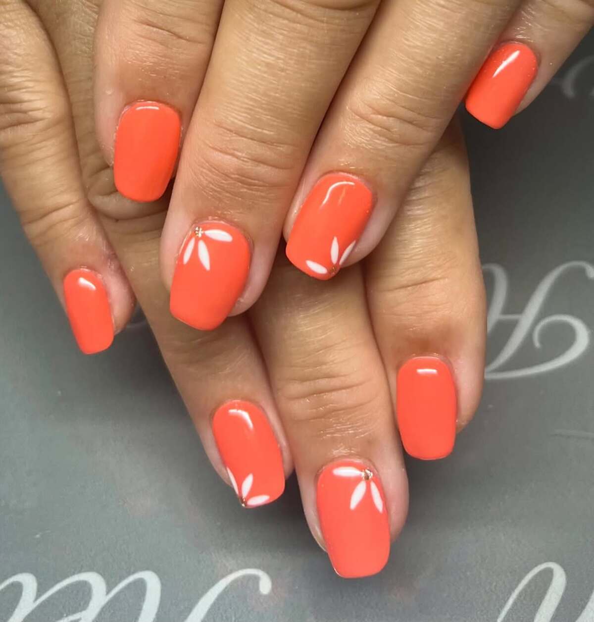 1. Minimalist Coral with Delicate Floral Accents