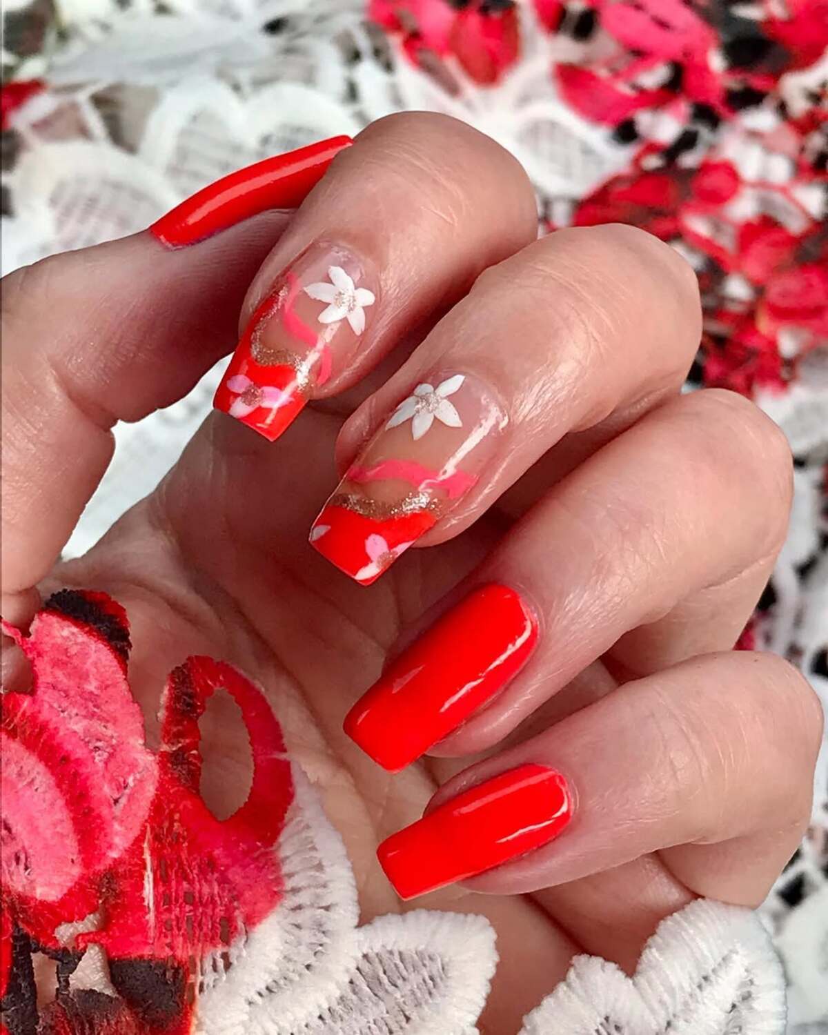 17. Bold Red-Coral French Tips with Floral Accents