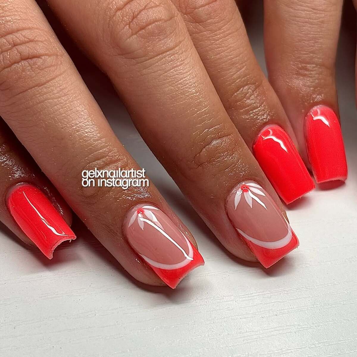 18. Glossy Coral with Minimalist Floral Accents