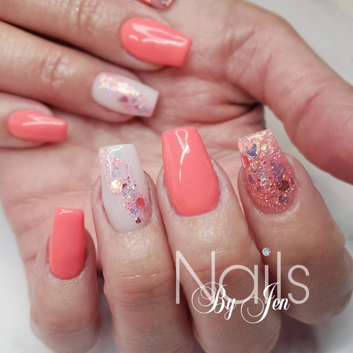 2. Coral and Glitter Elegance