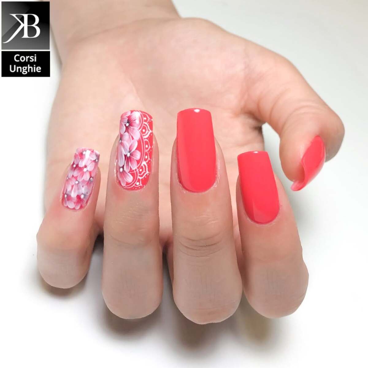 22. Bold Coral with Intricate Floral Detailing