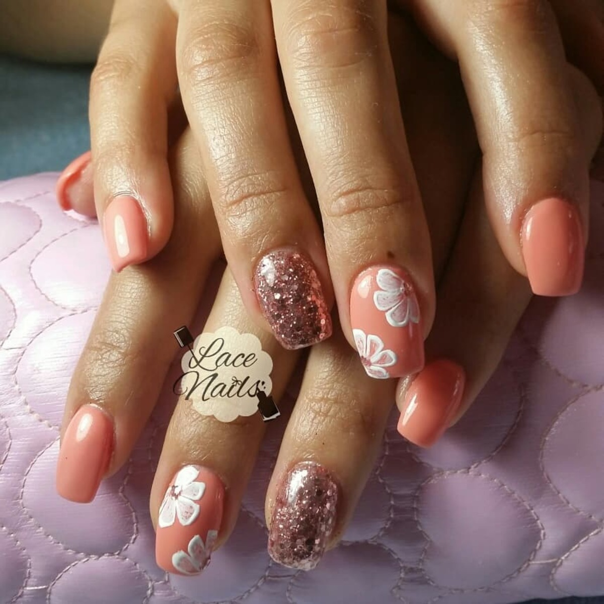 26. Soft Peach and Glittery Floral Accents