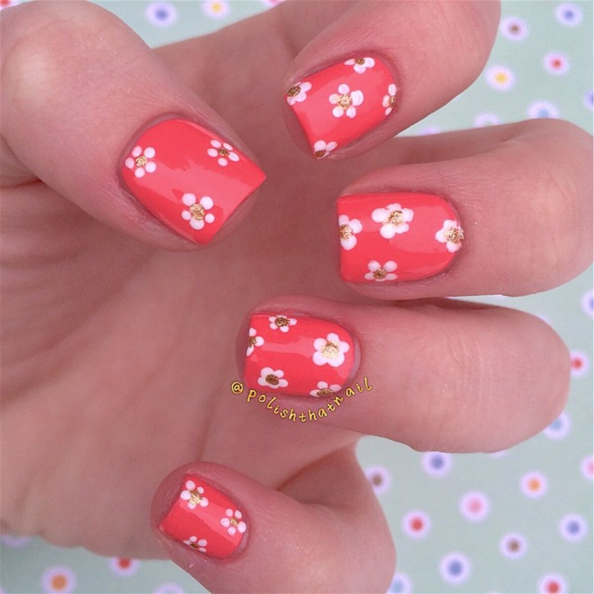 4. Playful Daisy Coral Nails