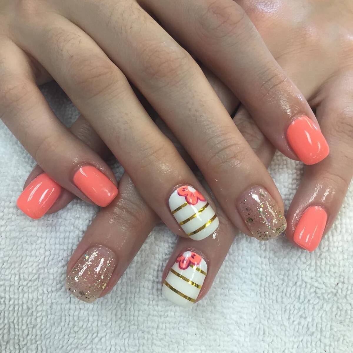 8. Striped and Floral Coral Nails