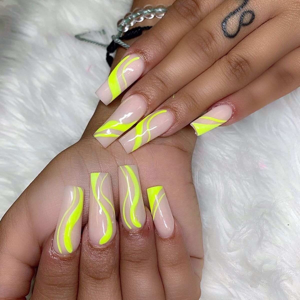 11. Neon Yellow Swirls for a Futuristic Glow