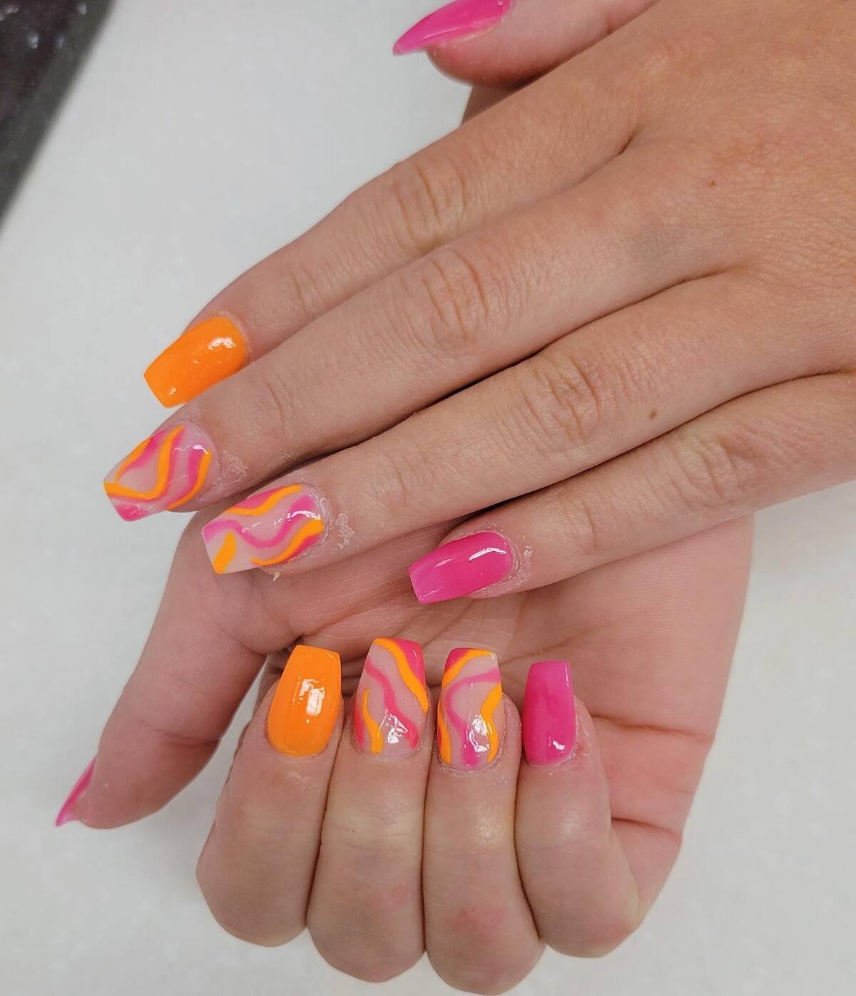 17. Sunset-Toned Pink and Orange Swirls