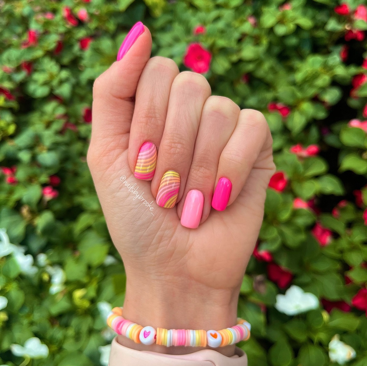 2. Playful Pink and Yellow Swirls for a Vibrant Summer Look